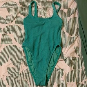 High leg, one piece swim suit! Worn once :)